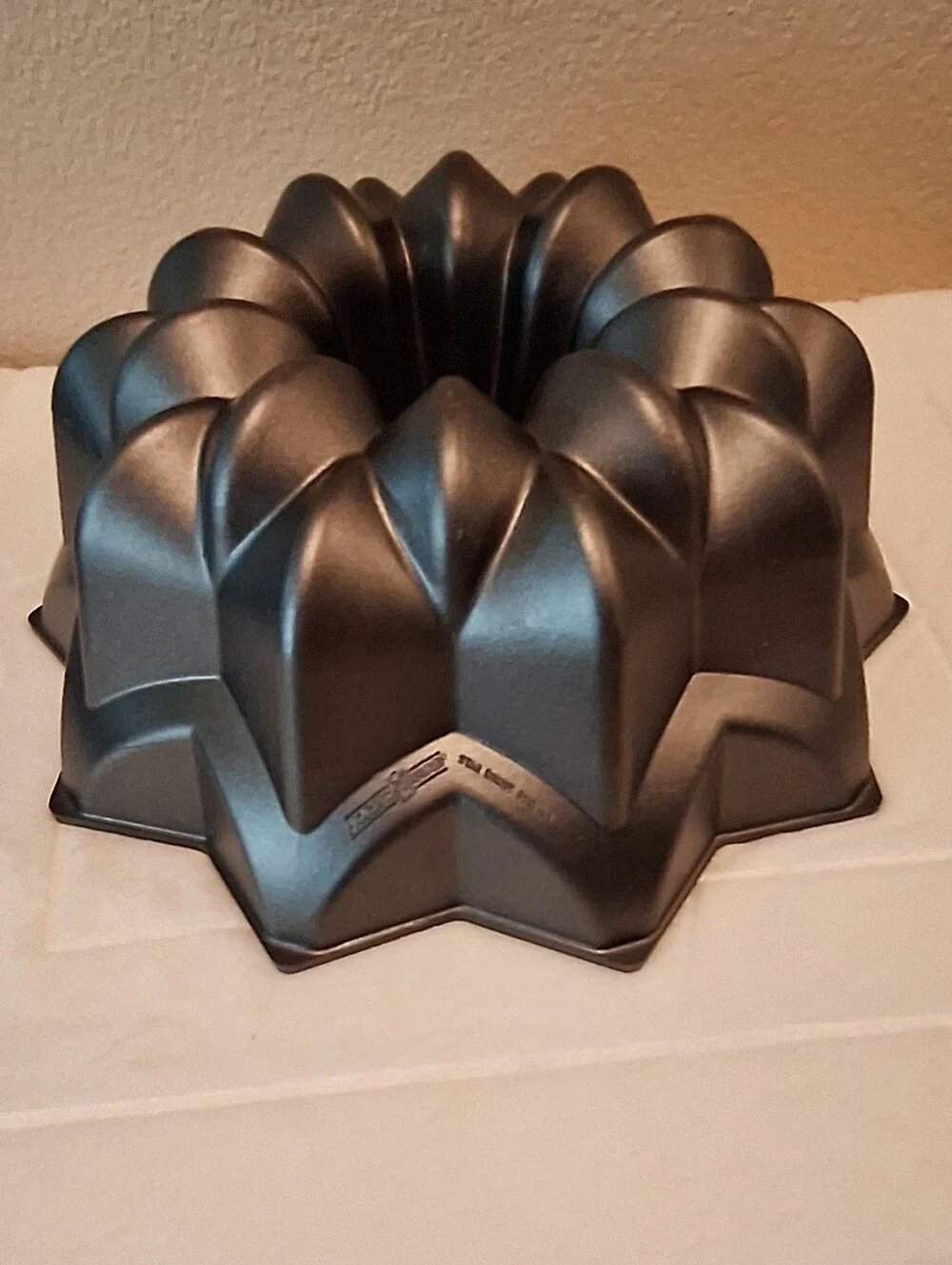 Nordic Ware Star Bundt Pan In Dark Gray. Sturdy Cast Aliminum Nonstick Coating.